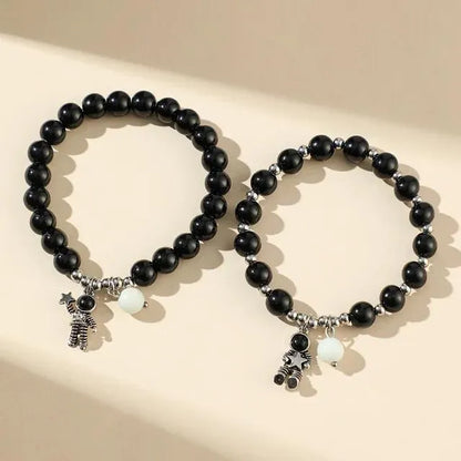 SET PULSERAS PAREJA LUMINOSA SAN VALENTÍN ASTRONAUTA NEGRO